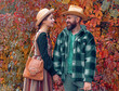 © Volodymyr - Couple in love in autumn leaves. Adventure, travel, tourism, hike and people concept. Couple in Autumn fall mood. Man and woman near Autumn fall leaves.