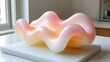 © Almaheera - Abstract pink and yellow decorative wavy form displayed in a minimalist interior space enhances