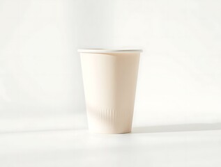 Poster - Minimalist composition of a paper cup isolated on a bright white background studio shot showcasing