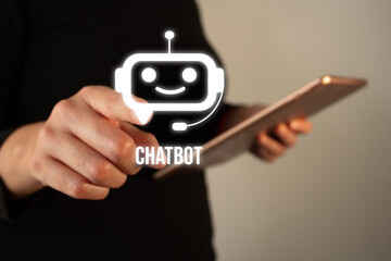 Poster - Businesswoman holding a tablet while pointing at a chatbot icon