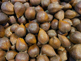 Freshly harvested tropical Snake skin fruits displayed in the market