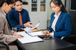 © laddawan - Business and lawyers discussing contract papers with brass scale on desk in office. Law, legal services, advice, justice and law