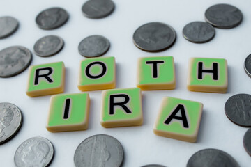 Aufkleber - ROTH IRA green accent letter tiles with coins isolated on a white background. Retirement and business news design element.