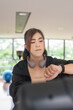 © Ranta Images - Asian non binary transgender woman in gym training for healthy fitness lifestyle with exercise bike