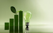 © blacksalmon - Green blocks forming  growing bar graph next to light bulb with leaf. Green business, Clean energy investment and eco-friendly innovation