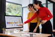 © David - Diverse Office Conference Room Meeting: Successful Asian Female Executive Director Presents e-Commerce Fintech Growth Statistics to a Team of Investors. Desktop Computer,with Big Data Analysis
