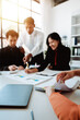 © Dino - Brainstorming with colleagues on paperwork, marketing, taxes, and company finances.