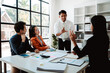 © Dino - Business handshake concept. Illustration of business people working together. Successful deal after a good meeting. Brainstorming of young modern group. Team meeting to achieve goal. Business people