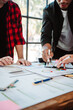 © Dino - Brainstorming of young modern group. Team meeting to achieve goal. Business people discussing finance business and analysis. Teamwork concept in modern office. Calculating personal tax for client.