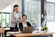 © David - Team of asian women putting hands up for new startup in the office