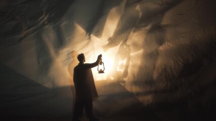 Poster - Exploring the mysterious cave with a lantern casting dramatic shadows at dusk