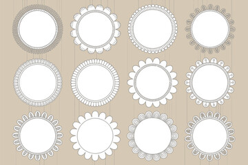 Poster - Collection of twelve decorative circular frames with various border designs on a beige background