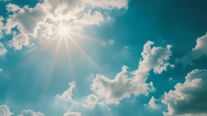 Wall Mural - a bright sun shining through fluffy white clouds on a clear blue sky