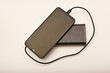 © Lushchikov Valeriy - Charging a mobile phone from a powerbank. Charging the gadget.