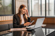 © Apichat - Stressed businesswoman having headache while reading bad news on smartphone in office