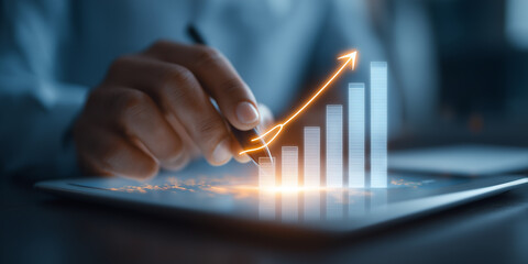 Poster - Person uses stylus on digital tablet, interacting with glowing upward graph, symbolizing growth and success in business analytics