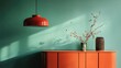 © Lemon - Teal wall, orange cabinet, red pendant lamp, dried botanicals