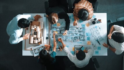 Poster - Time lapse of professional architect engineer team writing sticky notes and sticking note at house model while interior designer talking and discussing about building exterior designing. Alimentation.