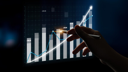 Poster - A hand is pointing at a digital chart representing financial growth. The glowing lines and upward bars symbolize positive trends and successful analysis. Impute