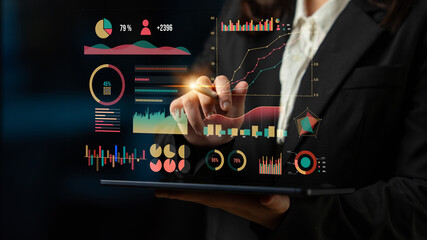 Poster - A business person interacts with a digital dashboard featuring graphs and charts to analyze data and performance metrics in a modern office setting. Impute