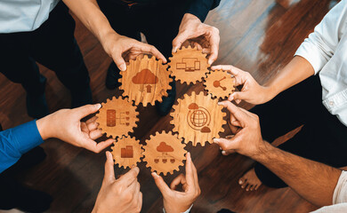 Poster - A group of business professionals collaborates with wooden gear icons symbolizing essential concepts in cloud computing, data management, and global connectivity, reflecting teamwork. Amity