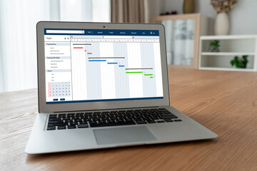 Poster - Project planning software for modish business project management on the computer screen showing timeline chart of the team project