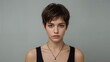 © Fitra - Natural beauty portrait of a young woman with short brown pixie cut hair