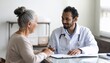 © nanik - Doctor and Senior Patient Consultation: Healthcare,  Medical Advice,  Wellbeing,  Trust,  Compassionate Care
