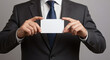 © Great - Businessman displaying blank business card.