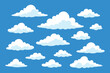 © Creative Instinct - Set of cartoon style white clouds in blue sky background in flat vector illustration