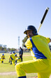 © Wavebreak Media - Mature male baseball batter holding bat over shoulder at suburban baseball field, copy space