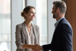 © Varitnan - Smiling woman shaking hands in job interview