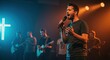 © Светлана Воротняк - Young man singing with microphone on stage during live concert. Christian worship music event. Gospel choir performance for church sermon.