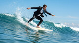 Confident businessman in a suit surfing a wave under a sunny sky, symbolizing overcoming challenges and success in business.