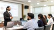 © N7 - Indian Corporate Team in Blurred Conference Room Presentation