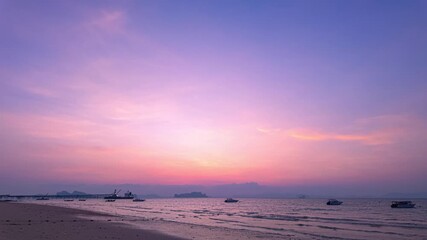 Wall Mural - Amazing sweet sky in sunset above the ocean at Tubkaek beach Krabi. 
beautiful sunset behind archipelago in Andaman sea. red sky background
Streaks of pink clouds light up in the sky at twilight