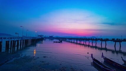 Wall Mural - Timelapse stunning the sun shining through the clouds above Chalong pier.
Scene of colorful yellow light through the clouds.
Gradient color. Sky texture, abstract nature background.