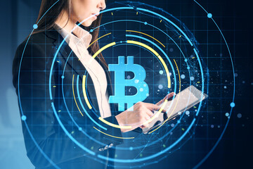 Poster - Businesswoman using tablet with glowing bitcoin symbol overlay and digital network graphics on dark background, representing cryptocurrency concept.
