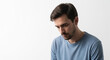 © nizar - Sad or Disappointed Young Man Looking Down on White Background