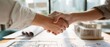 © Studio Nova - The handshake symbolizing collaboration and agreement in a professional setting.