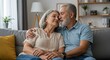 © Pix - Loving Elderly Married Couple Expressing Affection While Sitting On A Couch