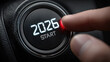 © syhin_stas - Close-up of a hand pressing a car start button with futuristic 2026 digital display, symbolizing automotive innovation, smart technology, electric vehicles, and advancements in modern transportation.