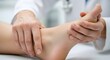 © Feri - Doctor examining patient's foot with soft focus on the hand. Healthcare professional assessing ankle's condition. Medical checkup of lower leg in white background.