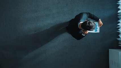 Poster - Top view of smart male leader calling phone while project manager give financial document. Businessman talking to investor to brainstorm idea by phone while looking at data analysis. Directorate.