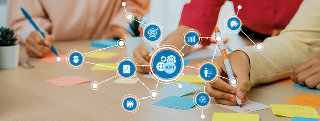 Poster - A dynamic office scene showcasing teamwork focused on key performance indicators with hands actively engaging in writing and organizing colorful notes for effective planning. Amity