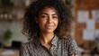 © Johannes - Smiling confident pretty millennial africanamerican woman look at camera standing at home office. Happy mixed race afro ethnic female college student, remote worker, professional freelancer portrait.