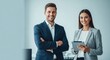 © Farhan - Portrait of a smiling professional man and woman team. Two happy colleagues with a tablet ready for a business presentation.