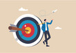 © Yeasin - Business objective, purpose or target, goal and resolution to aim for success, aspiration and motivation to achieve goal concept, confident businessman stand with arrow hit bullseye on archery target