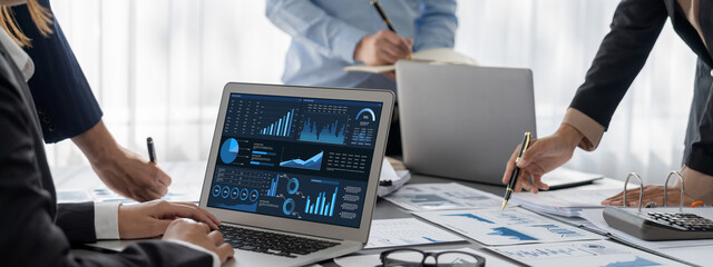 Poster - Business intelligence and data analysis concept. Analyst team working on financial data analysis dashboard on laptop screen as marketing indication for effective business strategic planning. Insight