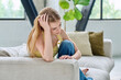 © Valerii Honcharuk - Sad unhappy upset young woman sitting at home on sofa, face close-up